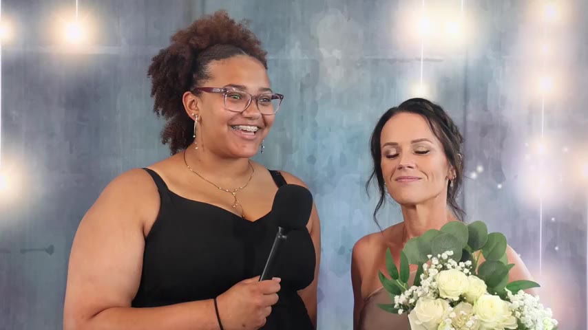 A wedding guest answering a question on camera at cocktail hour