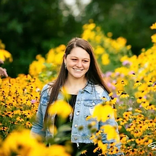 Bailey in a field of yellow flowers