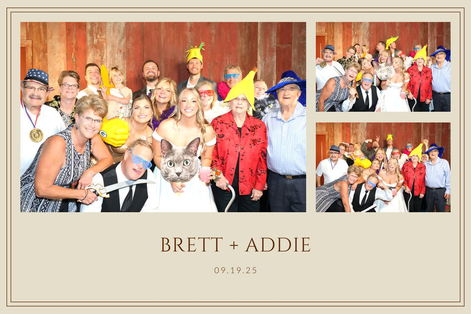 Brett and Addie's wedding guests crowded into a prop-filled booth photo