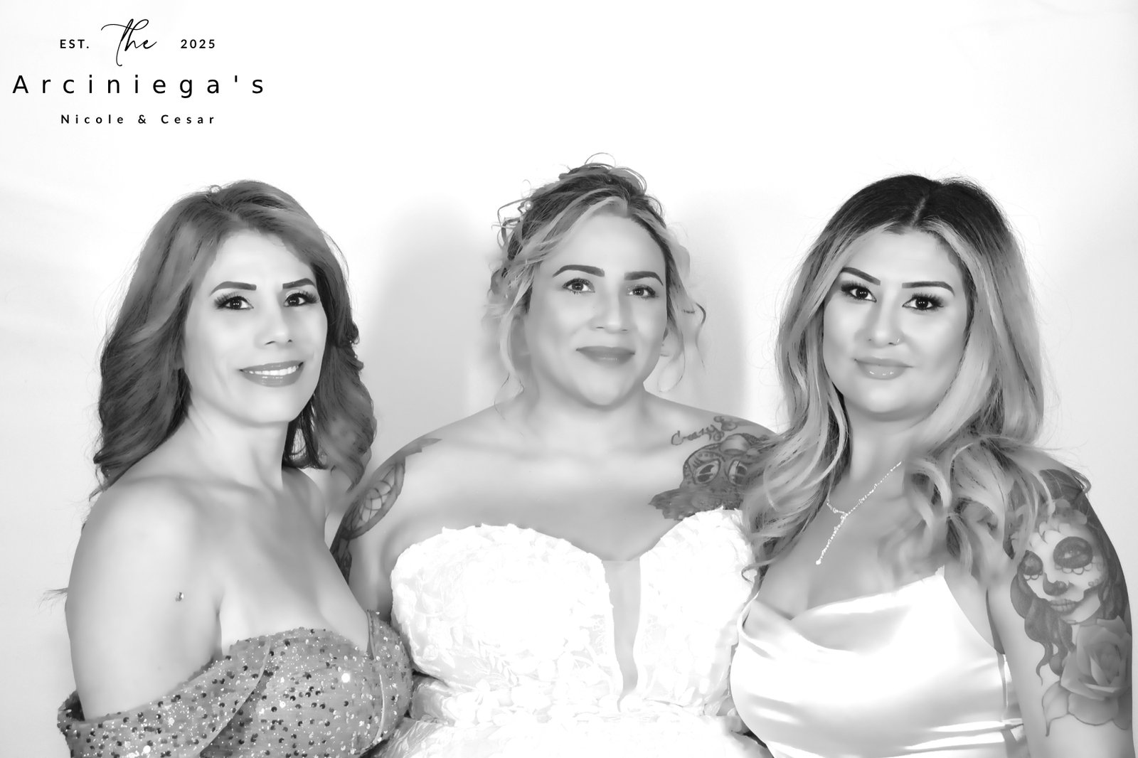 Bride laughing with friends in a black and white Glam portrait