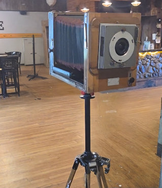 Close-up of the Heirloom camera's bellows and lens on its stand