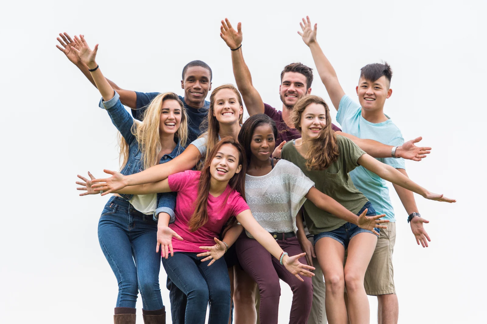 Group of students jumping with arms out