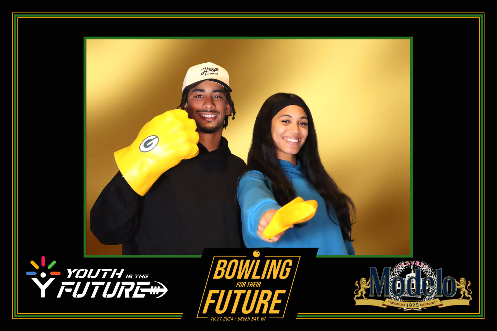 Guests in foam hands at a bowling fundraiser