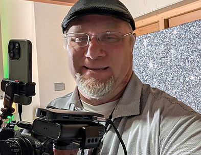 Peter McGreck behind the camera rig at an event