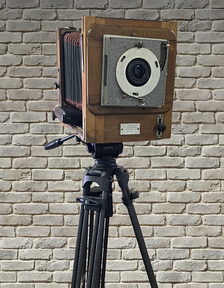 The Heirloom camera on its tripod, showing the bellows and nickel lens plate