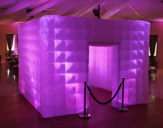 An inflatable LED glow cube lit pink